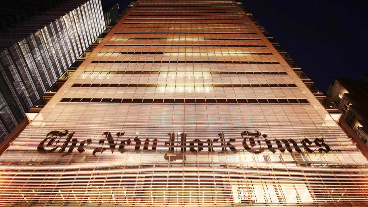 Person Climbs New York Times Building