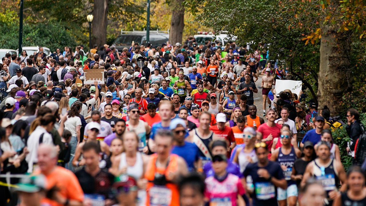 Runners make their way across the Verrazzano-Narrows Bridge during the start of the New York City Marathon, Sunday, Nov. 3, 2019, in New York.