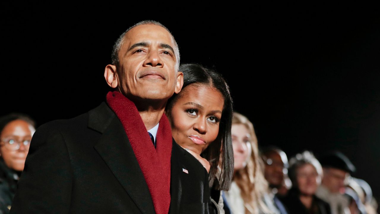 FILE - In this Dec. 1, 2016 file photo, President Barack Obama and first lady Michelle Obama watch the 2016 National Christmas Tree lighting ceremony in Washington. (AP Photo/Pablo Martinez Monsivais, File)