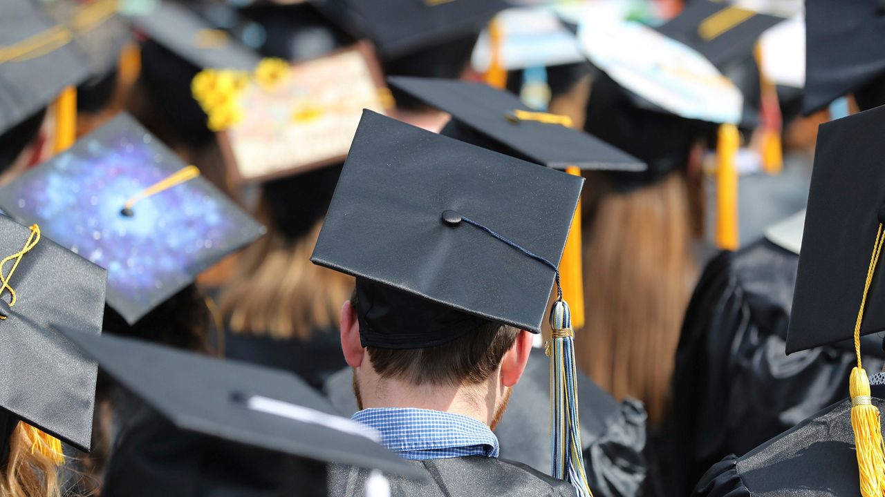 Students look forward during a college graduation ceremony. (File)