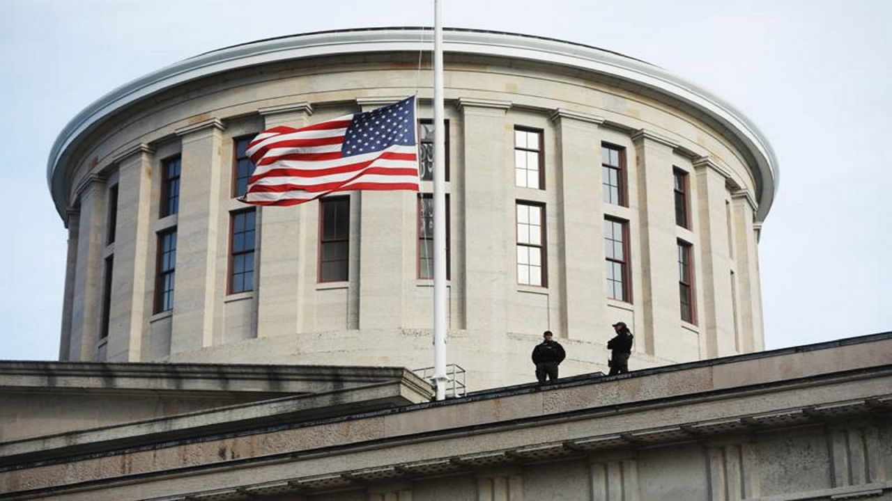 FILE—In this file photo from Jan. 13, 2021, troopers are visible on the Ohio Statehouse roof in Columbus, Ohio. 