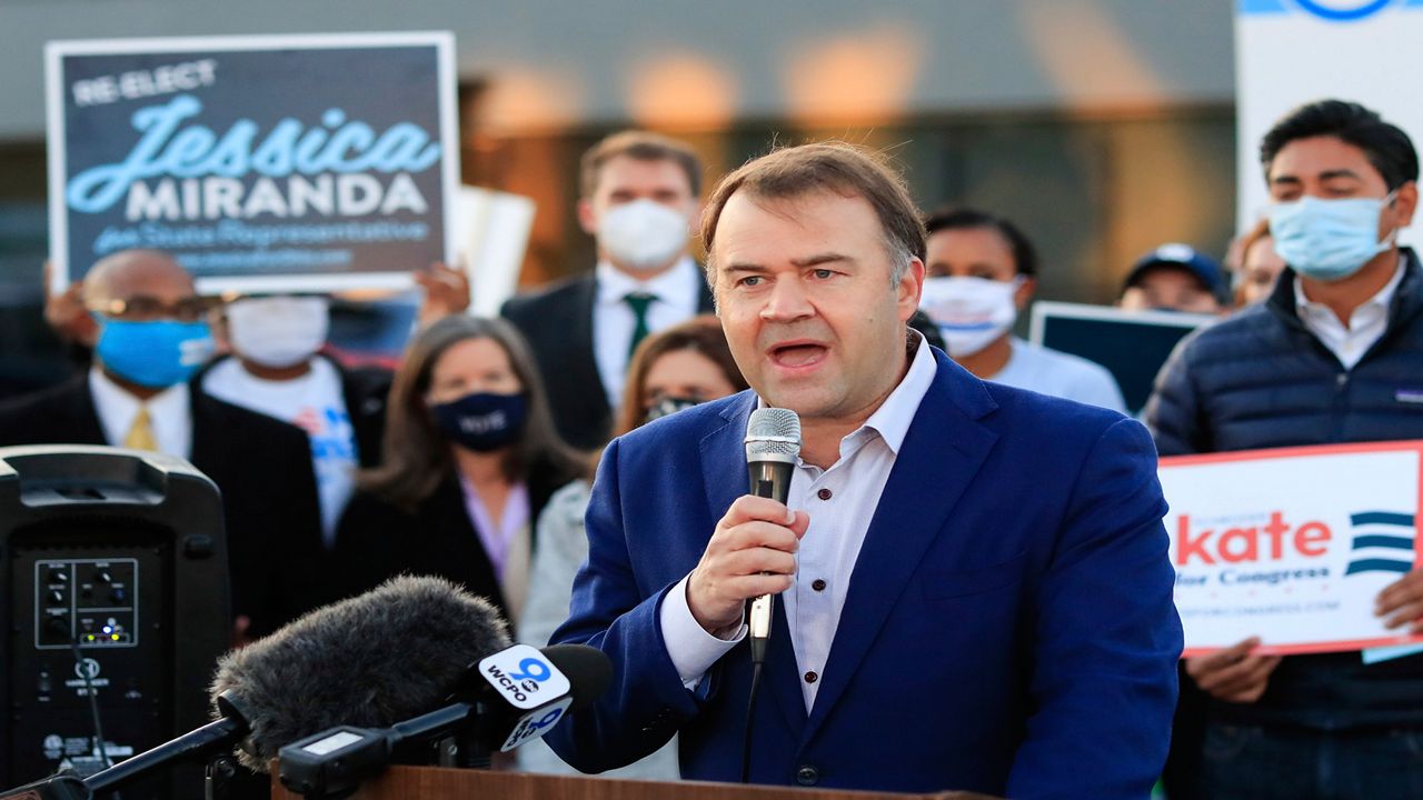 In this file photo from Oct. 6, 2020, David Pepper, the chairman of the Ohio Democratic Party, speaks at the Hamilton County Board of Elections as people arrive to participate in early voting in Norwood, Ohio. Pepper announced Monday, Nov. 30, 2020 that he is stepping down at the end of the year. (AP Photo/Aaron Doster, File)