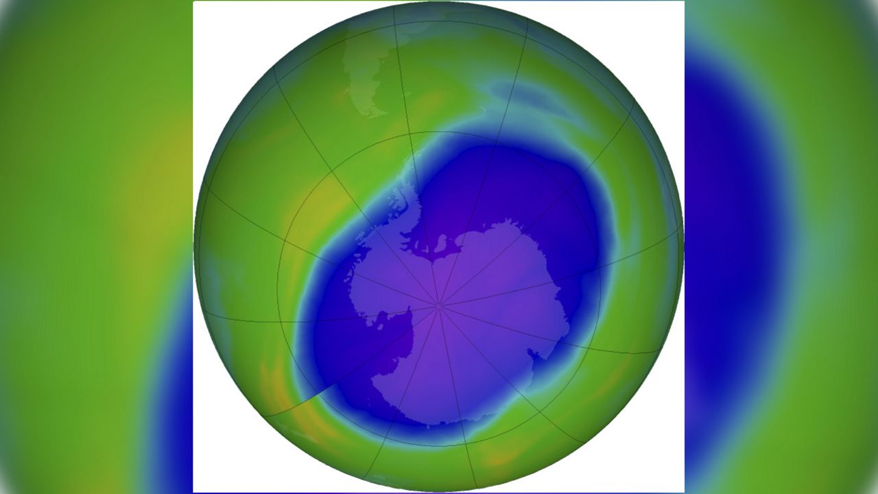 In this NASA false-color image, the blue and purple shows the hole in Earth's protective ozone layer over Antarctica on Oct. 5, 2022. (NASA via AP)