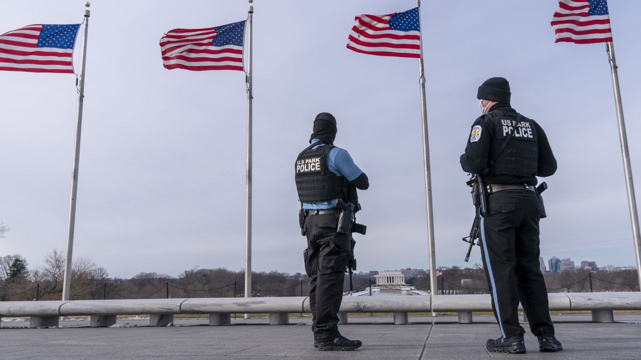 FILE: U.S. Park Police patrol at the Washington Monument, with the Lincoln Memorial in the background, Thursday, Jan. 6, 2022. (AP Photo/Jacquelyn Martin)