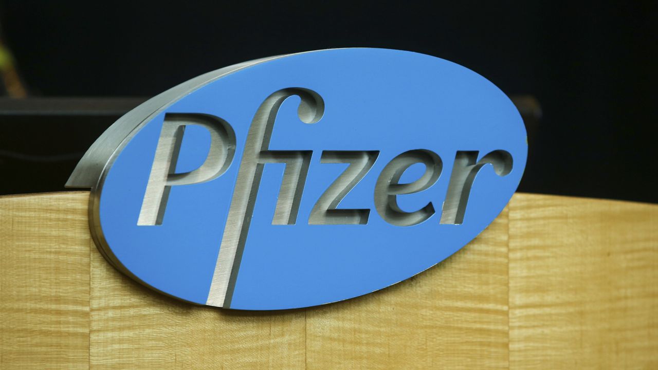 FILE - In this file photo dated Wednesday, July 22, 2020, a Pfizer sign is seen on a podium at the Pfizer Research & Development Laboratories, in Groton, USA. (AP Photo/Stew Milne)