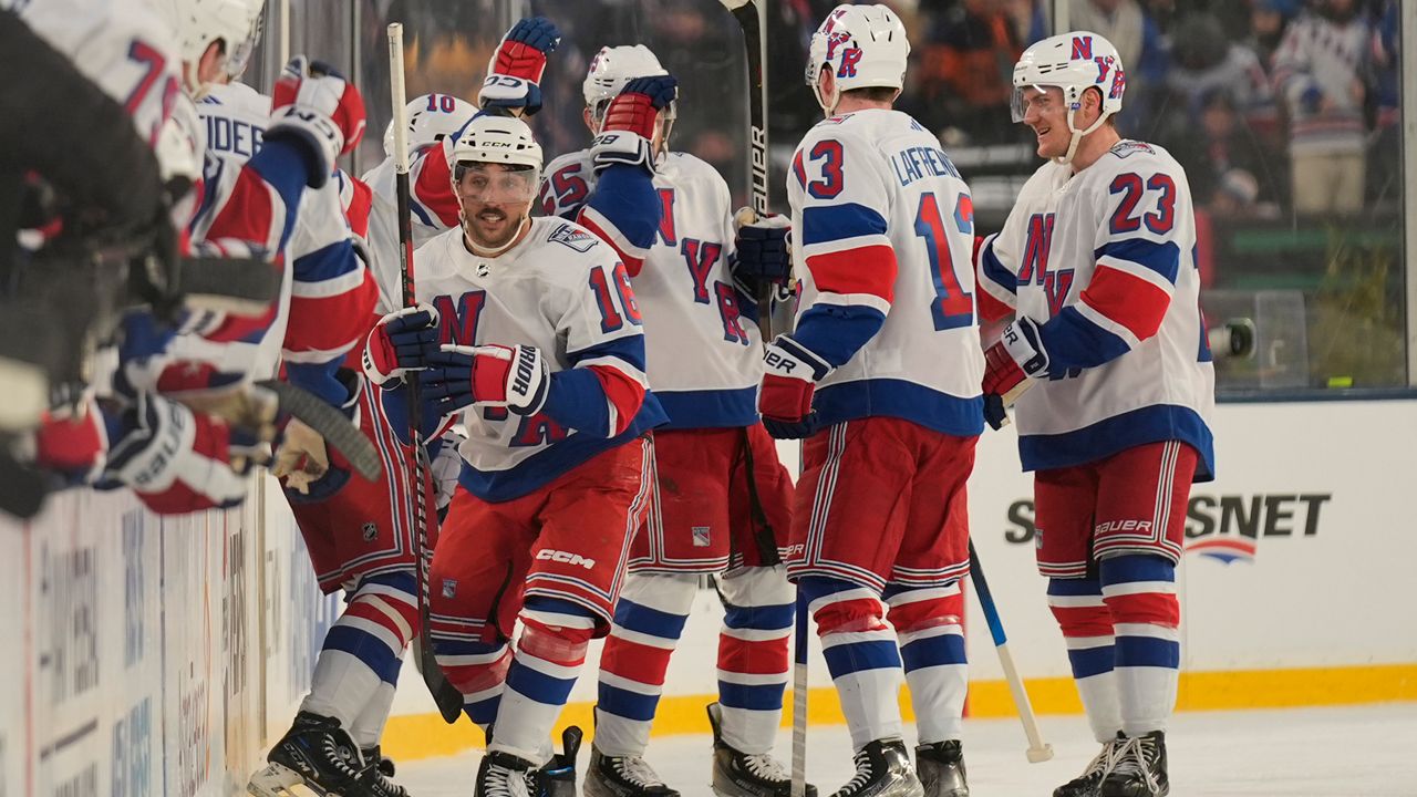 The Rangers celebrate a goal in the second period.
