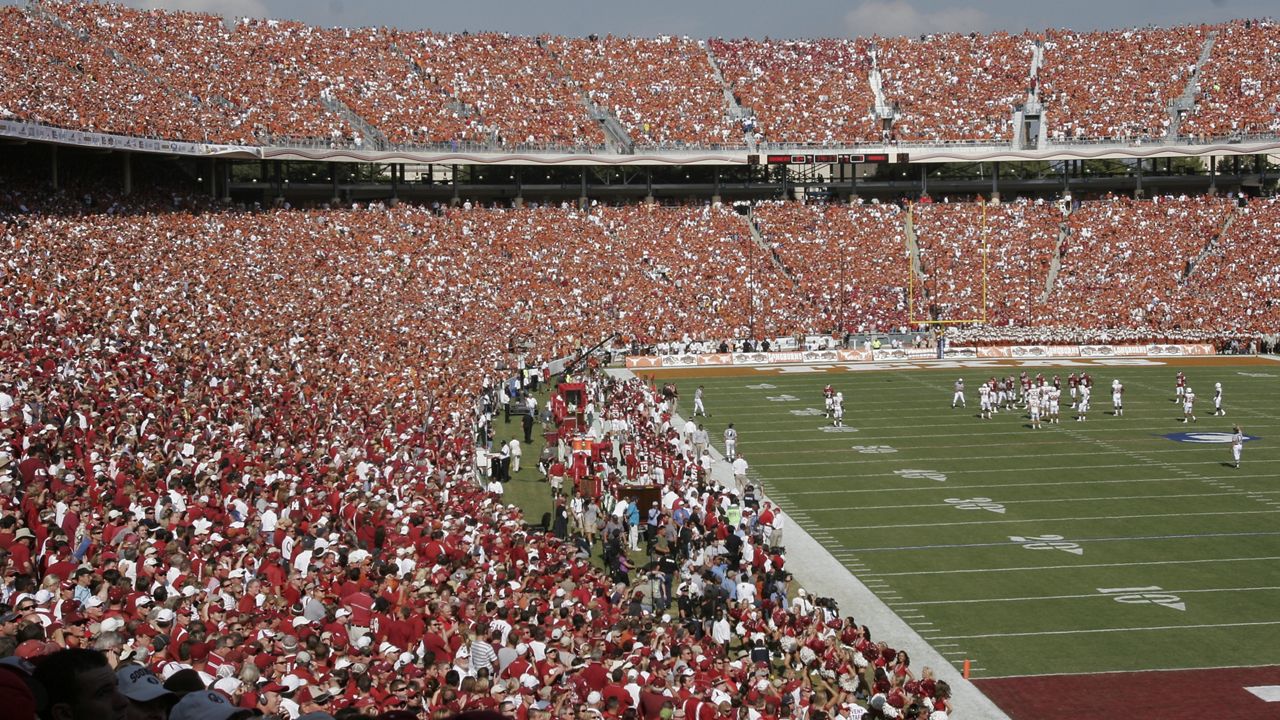 Divided at the 50-yard line, Oklahoma fans in red and Texas fans in burnt orange fill the Cotton Bowl for the annual Red River Rivalry NCAA college football game Oct. 11, 2008, in Dallas. (AP Photo/Ron Heflin, File)