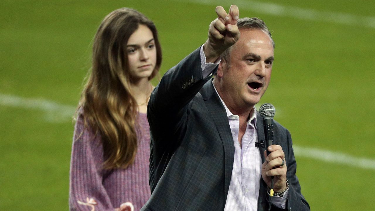 Sonny Dykes does the horned frog salute after being introduced and addressing the crowd as the new TCU head football coach at an event at Amon G. Carter Stadium at Texas Christian University, Monday, Nov. 29, 2021, in Fort Worth, Texas. (AP Photo/Richard W. Rodriguez)