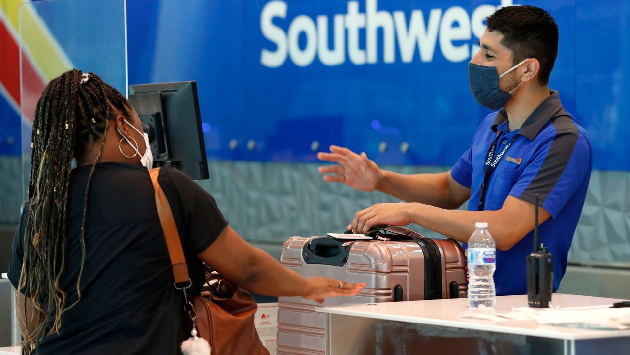 masked man in an airport