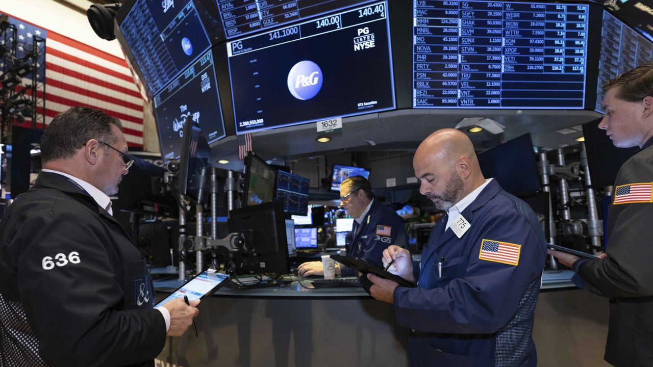 In this photo provided by the New York Stock Exchange, traders work on the floor of the exchange on Tuesday, Sept. 13, 2022. (Courtney Crow/NYSE via AP)
