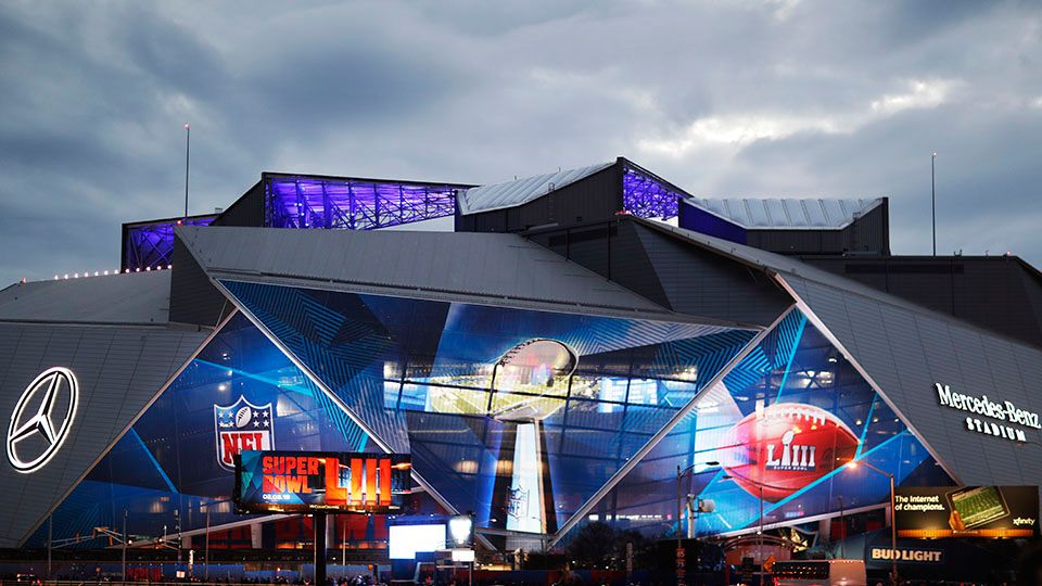 Mercedes-Benz Stadium is lit up ahead of Sunday's NFL Super Bowl 53 football game between the Los Angeles Rams and New England Patriots in Atlanta, Saturday, Feb. 2, 2019. (AP Photo/David Goldman)