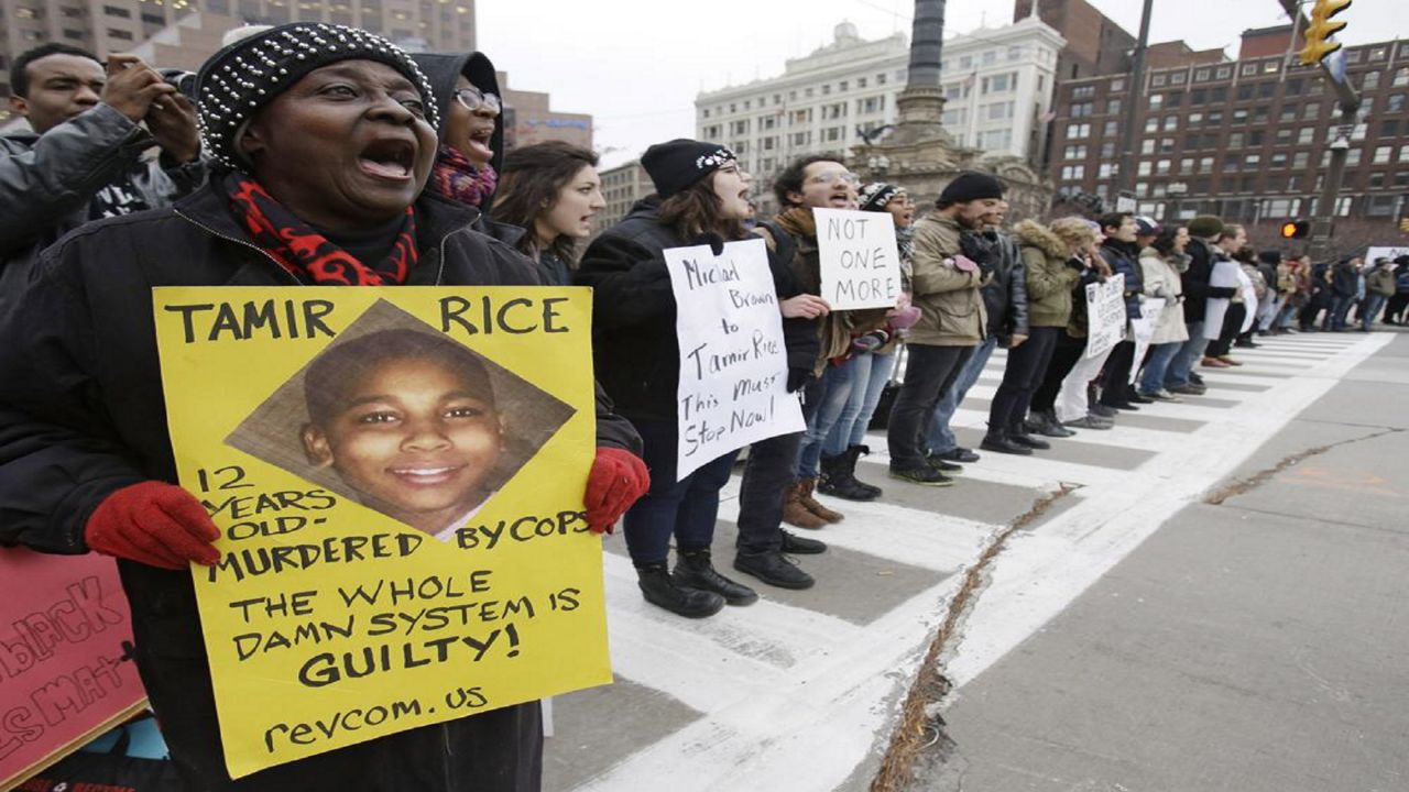 FILE - In this Nov. 25, 2014 file photo, demonstrators block Public Square in Cleveland, during a protest over the police shooting of 12-year-old Tamir Rice.  (AP Photo/Tony Dejak, File)