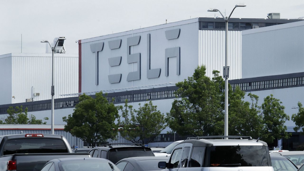 An image of a Tesla manufacturing building (AP Image/File)