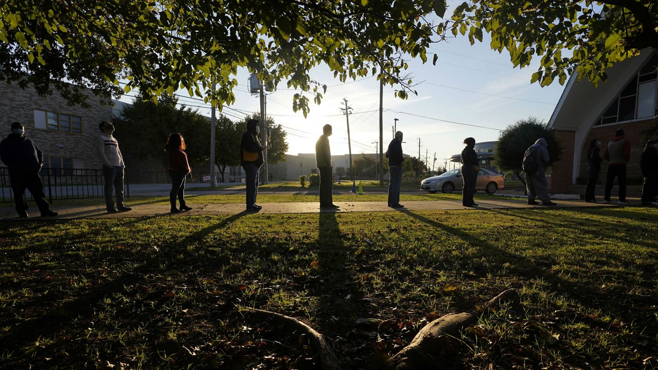Voters line up outside Vickery Baptist Church waiting to cast their ballots on Election Day Tuesday, Nov. 3, 2020, in Dallas. (AP Photo/LM Otero)