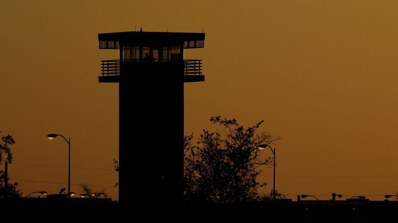 FILE - Part of the Texas Department of Criminal Justice's William G. McConnell Unit in Beeville, Texas, stands at sunset Wednesday, April 15, 2020. (AP Photo/Eric Gay)