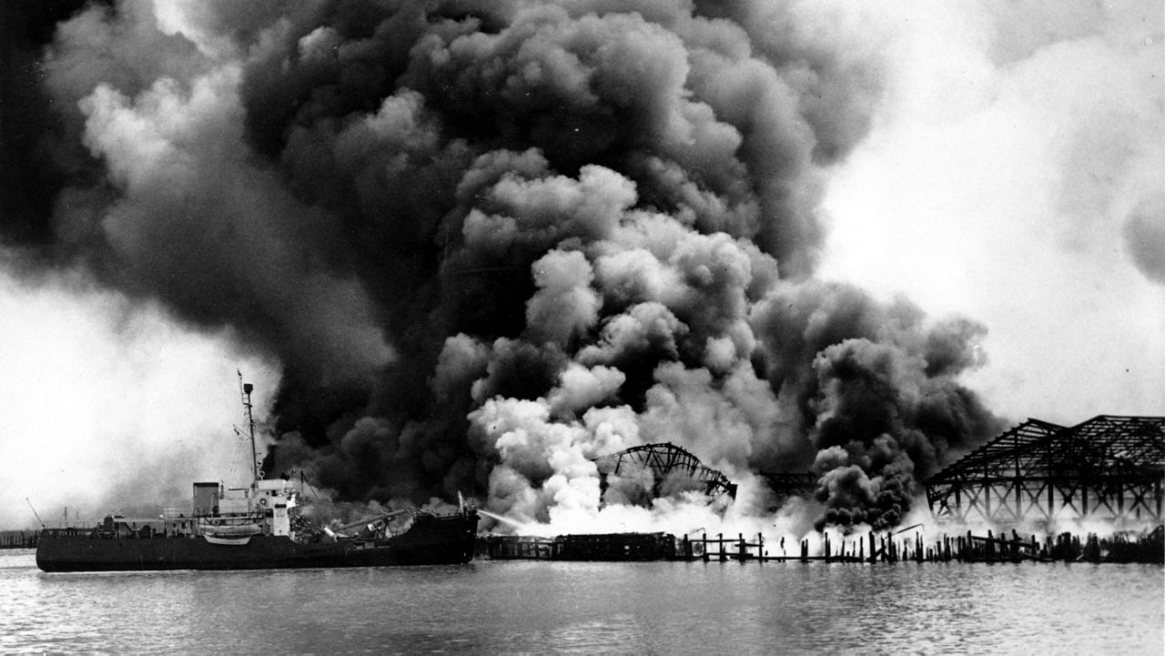 U.S. Coast Guard cutter Iris assists in fighting fire at the Monsanto Chemical Company refineries and oil storage tanks that exploded in the waterfront area in Texas City, Texas, on April 16, 1947. (AP Photo/U.S. Coast Guard)