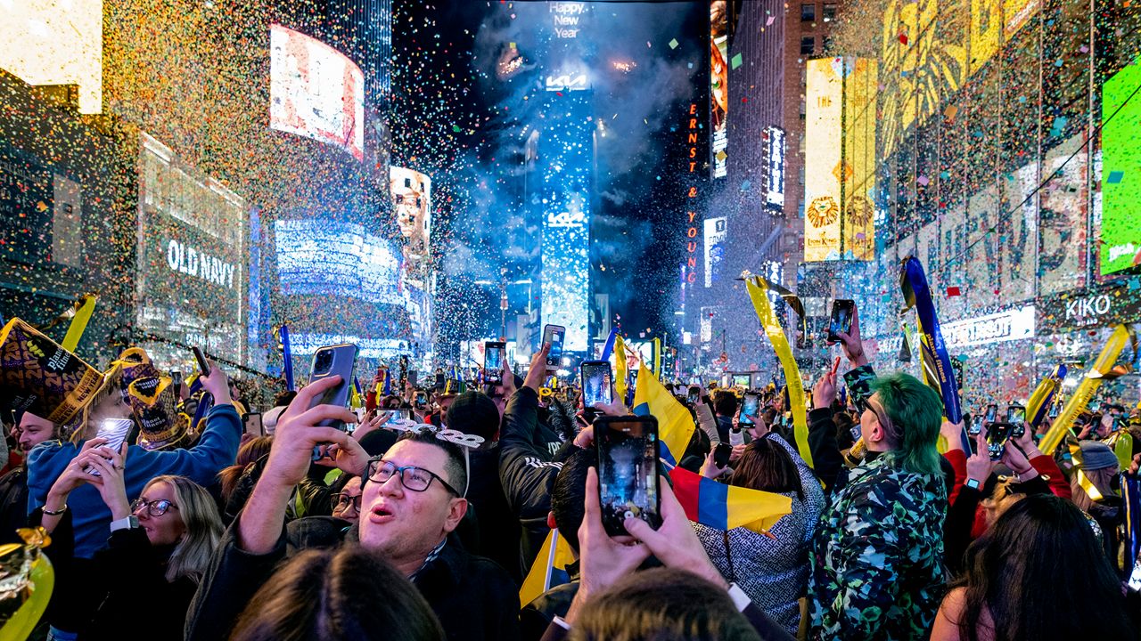 Revelers gather to watch the ball drop in Times Square on New Year's Eve. 
