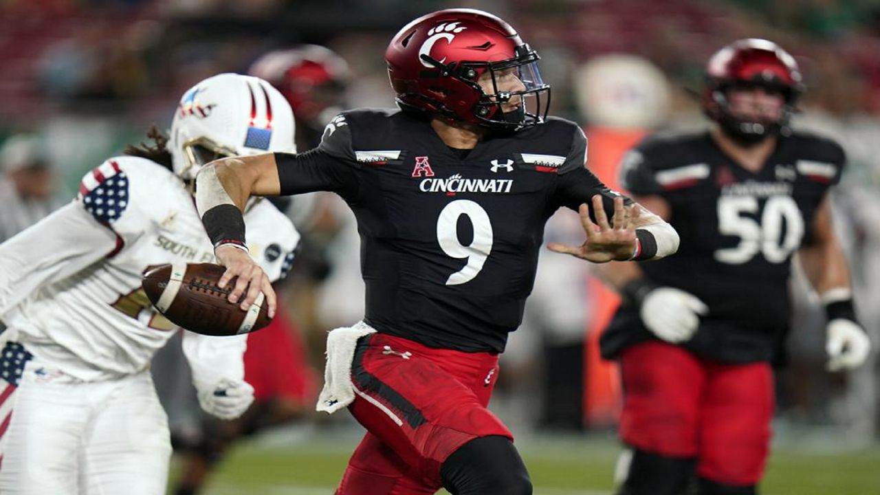 Quarterback Desmond Ridder of the Cincinnati Bearcats throws a pass