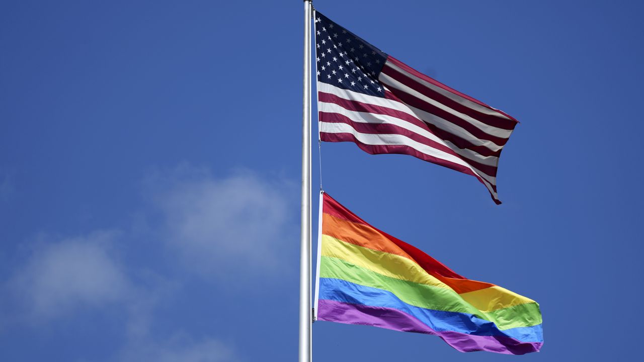 A Pride flag is flown beneath and American flag in this file image. (AP Photo)