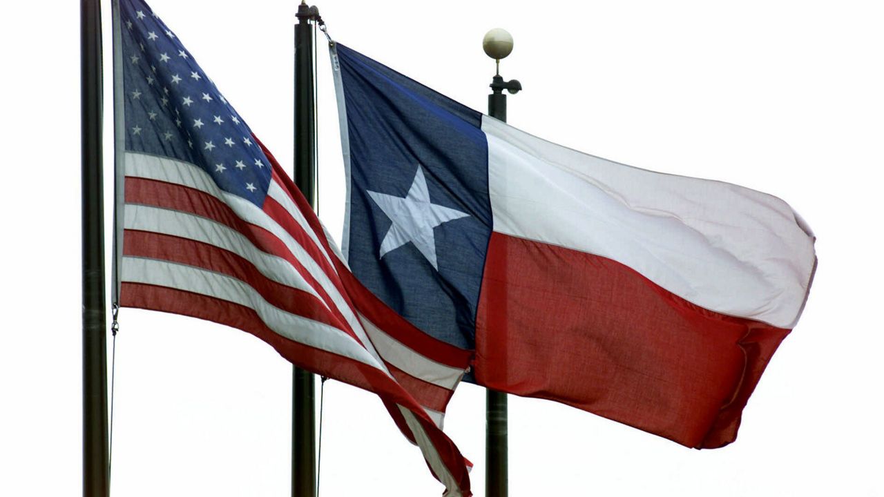 A United States flag, left, and a Texas flag, fly near the LBJ Freeway in Dallas, Monday, Feb. 26, 2001. Friday, March 2, 2001, is Texas Flag Day. State law mandates its observance on Texas Independence Day, which marks the anniversary of March 2, 1836, when Texas signed its Declaration of Independence from Mexico. (AP Photo/Donna McWilliam)