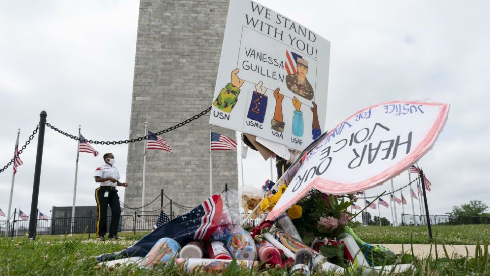 A makeshift memorial for U.S. Army Specialist Vanessa Guillen, is seen at the base of the Washington Monument, Tuesday, July 7, 2020, in Washington. An Army commander confirmed Monday that dismembered remains found last week buried near Fort Hood belonged to Guillen, who vanished more than two months ago from the Texas base. (AP Photo/Carolyn Kaster)