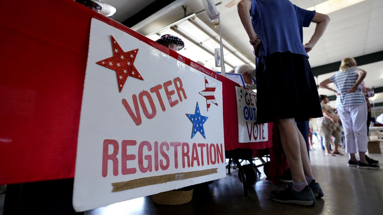 A voter registration table is seen at a political event for Texas gubernatorial candidate Beto O'Rourke, Wednesday, Aug. 17, 2022, in Fredericksburg, Texas. (AP Photo/Eric Gay)