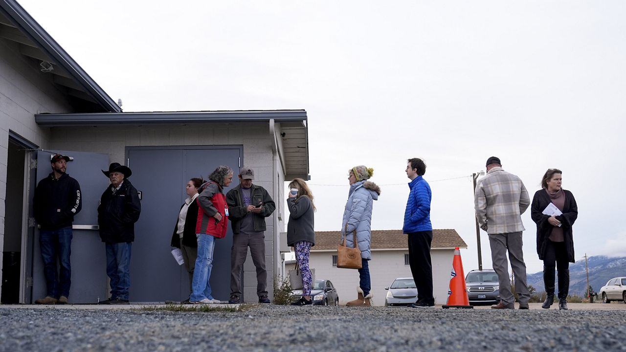 Voters wait in line outside the South Valley Volunteer Fire Department and Community Center Station 227, Tuesday, Nov. 5, 2024, in New Washoe City, Nev. (AP Photo/Godofredo A. Vasquez)