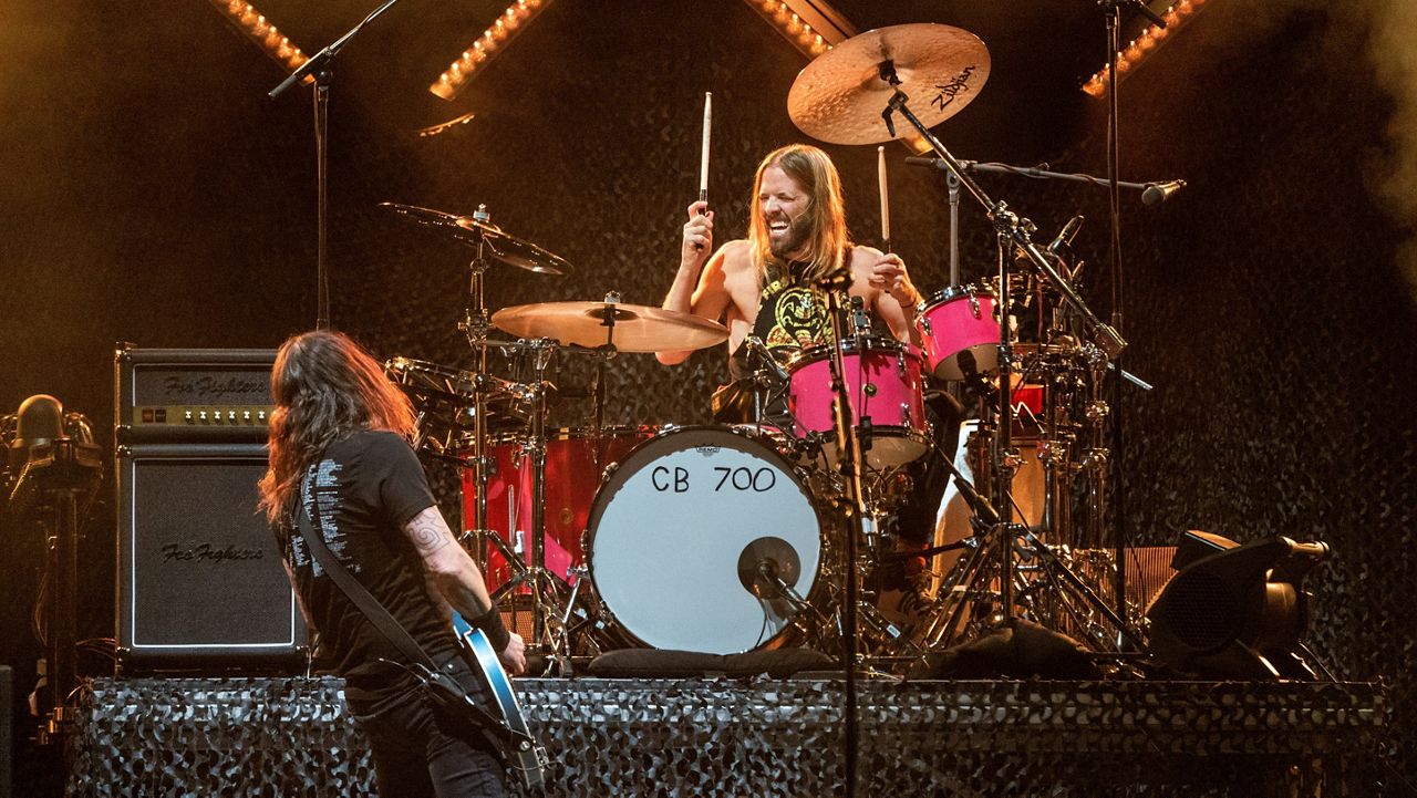 Dave Grohl, left, and Taylor Hawkins of the Foo Fighters perform at Innings Festival at Tempe Beach Park on Saturday, Feb, 26 2022, in Tempe, Ariz. (Photo by Amy Harris/Invision/AP)