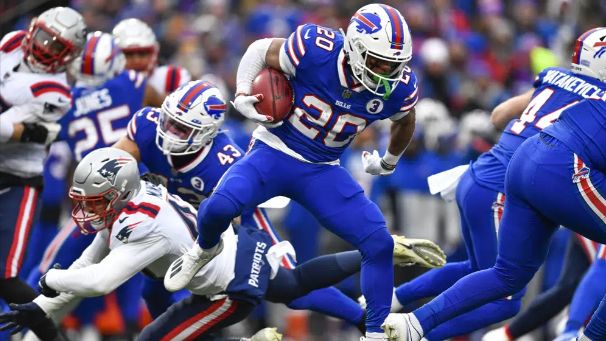 Buffalo Bills place kicker Tyler Bass (2) kicks a PAT during the first half  of an NFL football game against the New England Patriots on Sunday, Jan. 8,  2023, in Orchard Park