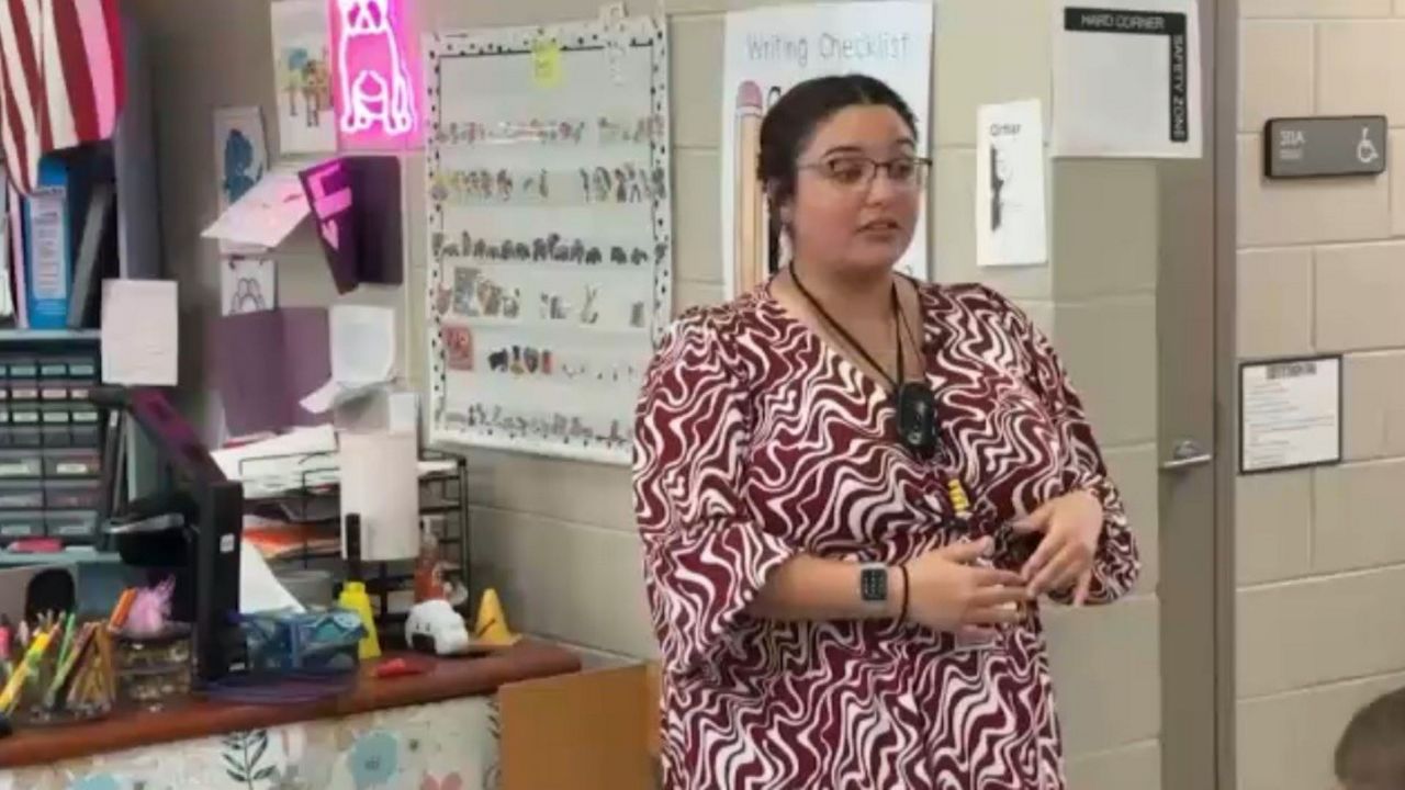 Amani Al-Ajil likes to incorporate music into the math and science lessons for her 2nd-grade students at Bailey Elementary School. (Spectrum News)