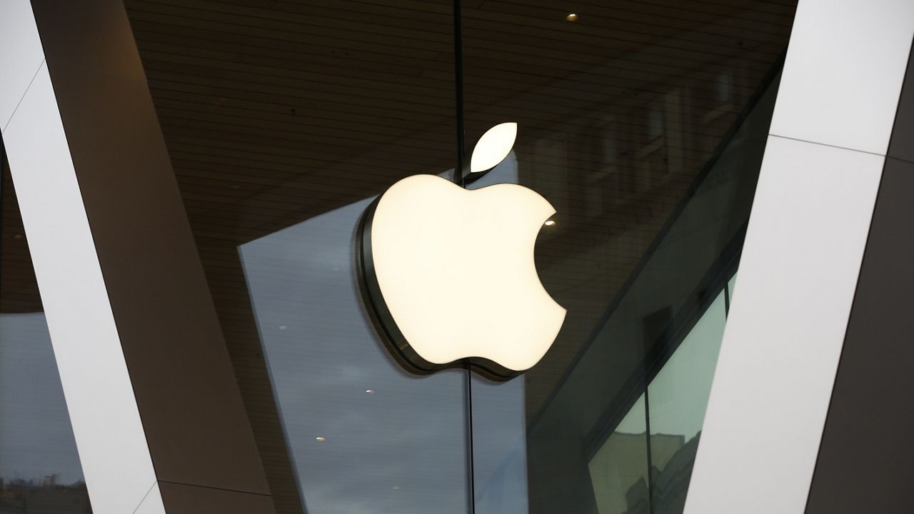 An Apple logo adorns the facade of the downtown Brooklyn Apple store on March 14, 2020, in New York. (AP Photo/Kathy Willens, File)