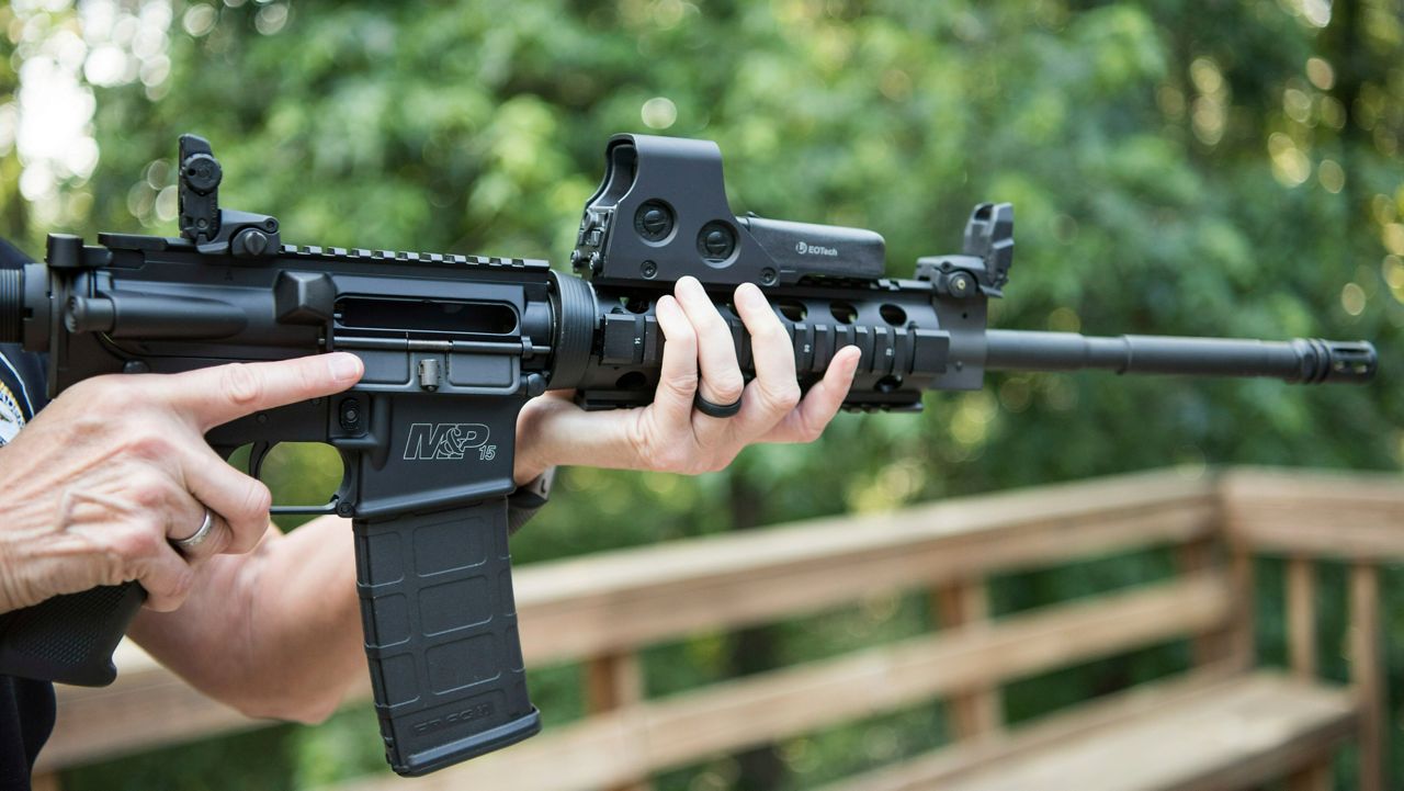 In this June 24, 2016, file photo, an AR-15 is held in Auburn, Ga. (AP Photo/Lisa Marie Pane, File)