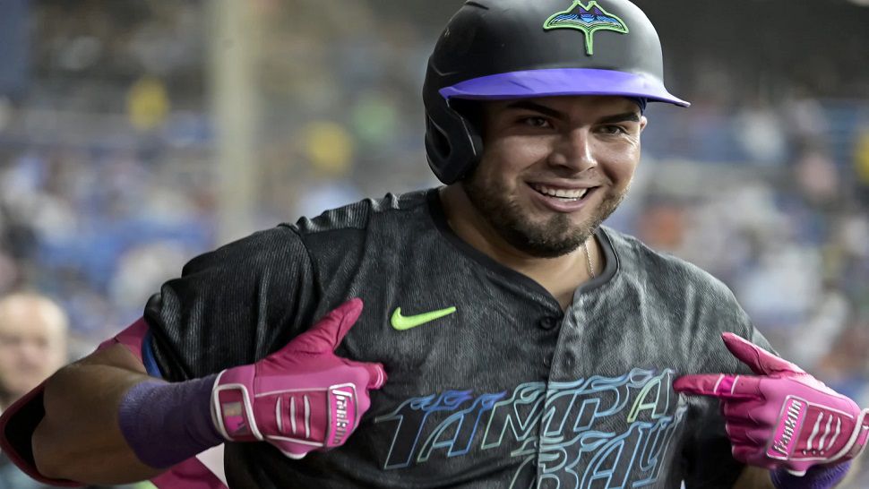 Tampa Bay Rays' Jonathan Aranda celebrates in the dugout after his two-run home run off Toronto Blue Jays starter Yariel Rodríguez during the third inning of a baseball game Saturday, Sept. 21, 2024, in St. Petersburg, Fla. (AP Photo/Steve Nesius)