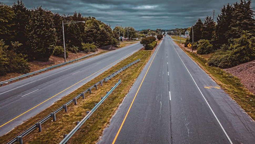 An empty stretch of highway appears in this stock image. (Pixabay)