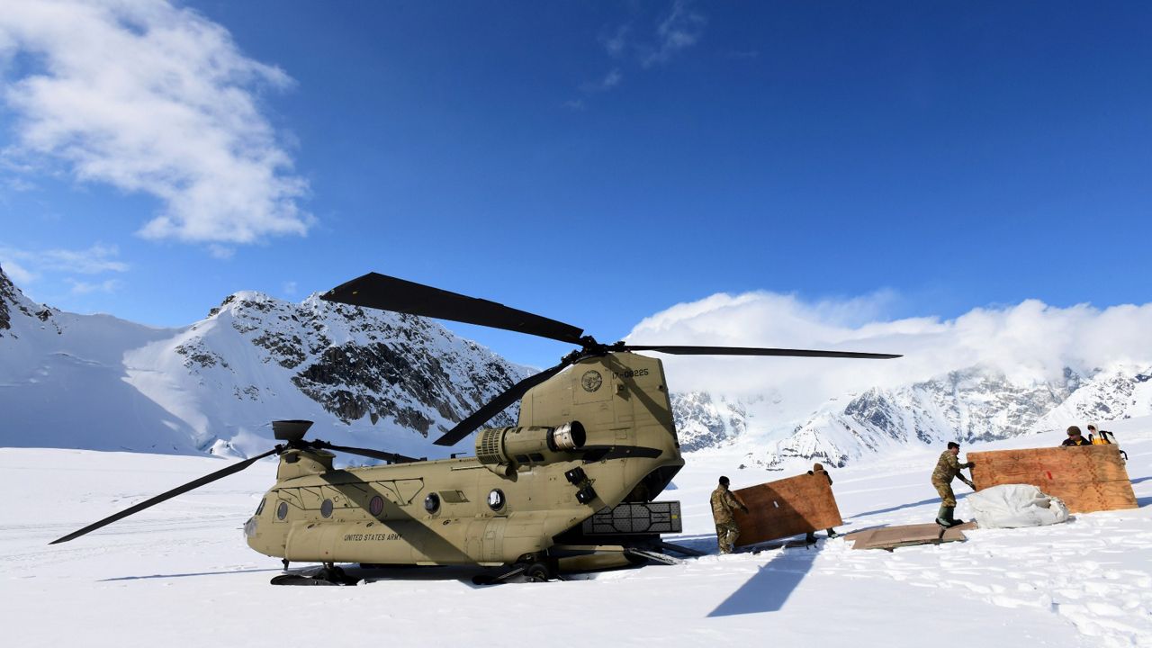 Soldiers and National Park Service personnel offload equipment and supplies from a U.S. Army CH-47 Chinook helicopter on Kahiltna Glacier on April 27. (John Pennell/U.S. Army via AP, File)