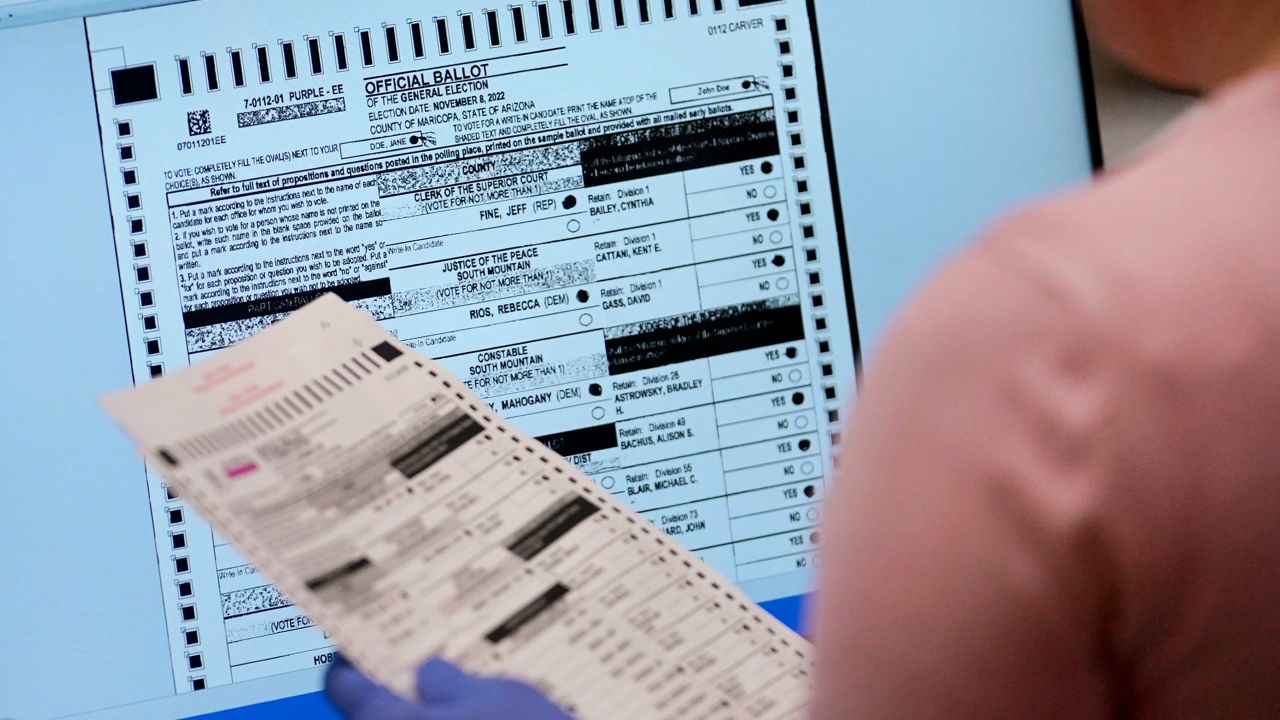 An election worker verifies a ballot on a screen inside the Maricopa County Recorders Office on Nov. 10, 2022, in Phoenix. (AP Photo/Matt York, File)