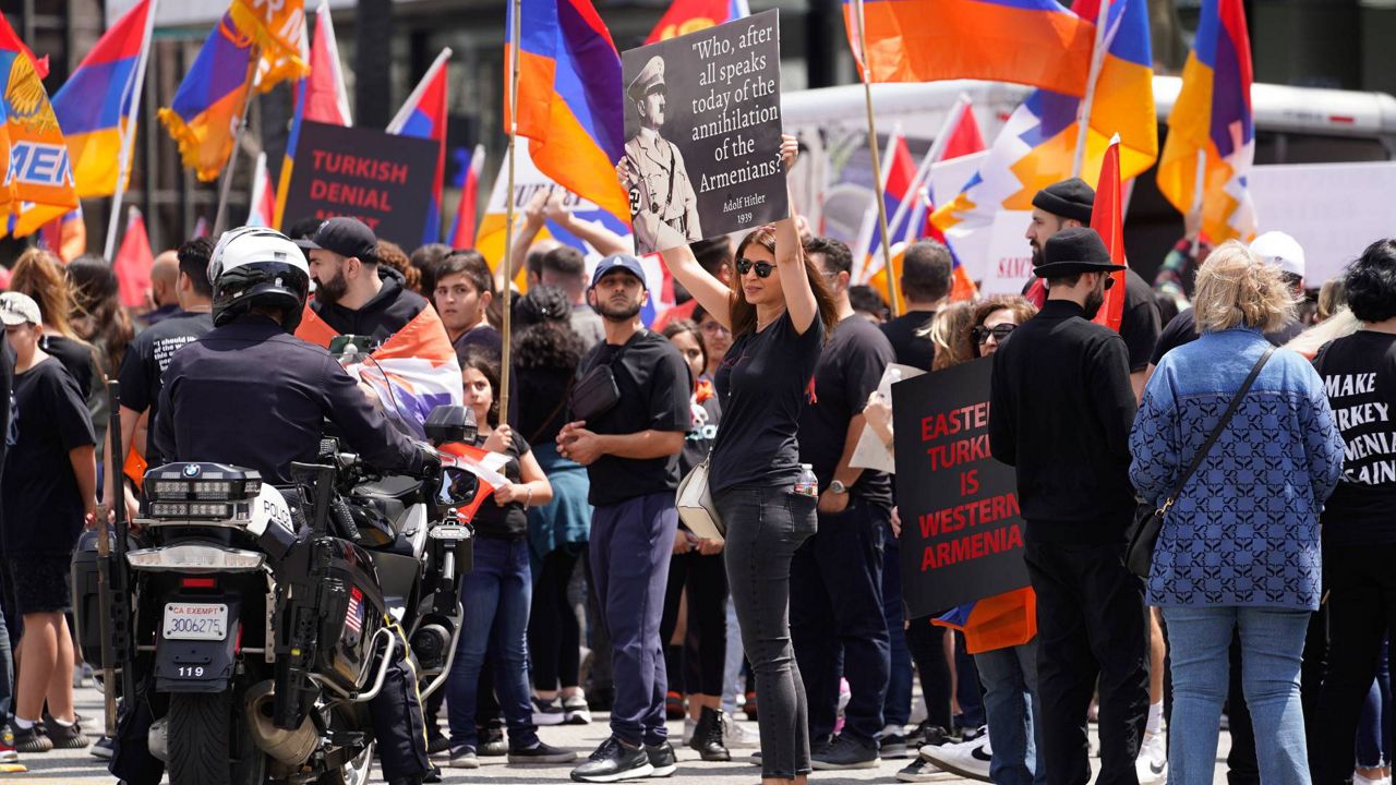 Armenian Americans commemorate the 108th anniversary of the Armenian Genocide Remembrance Day with a protest outside the Consulate of Turkey in Beverly Hills, Calif., on Monday. (AP Photo/Damian Dovarganes)