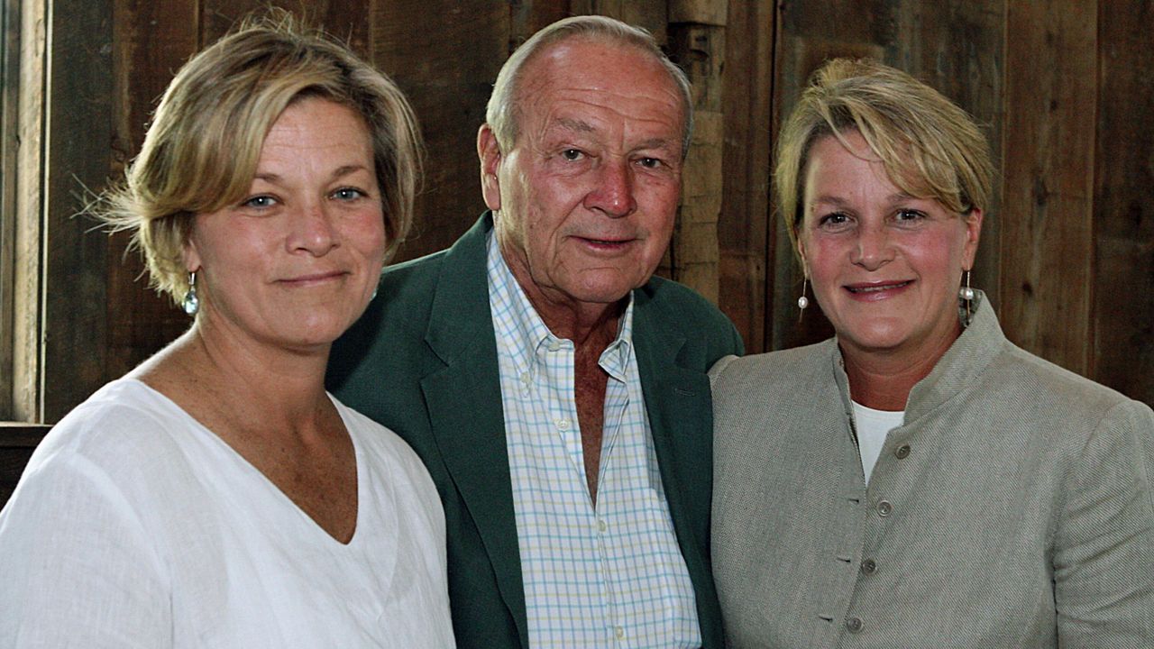 Arnold Palmer, center, is seen with his daughters, Peggy Palmer, left, and Amy Saunders inside the barn of the Winnie Palmer Nature Reserve, in Latrobe, Pa., during the dedication of the reserve June, 30, 2007. (Kim Stepinsky/Pittsburgh Tribune-Review via AP, File)