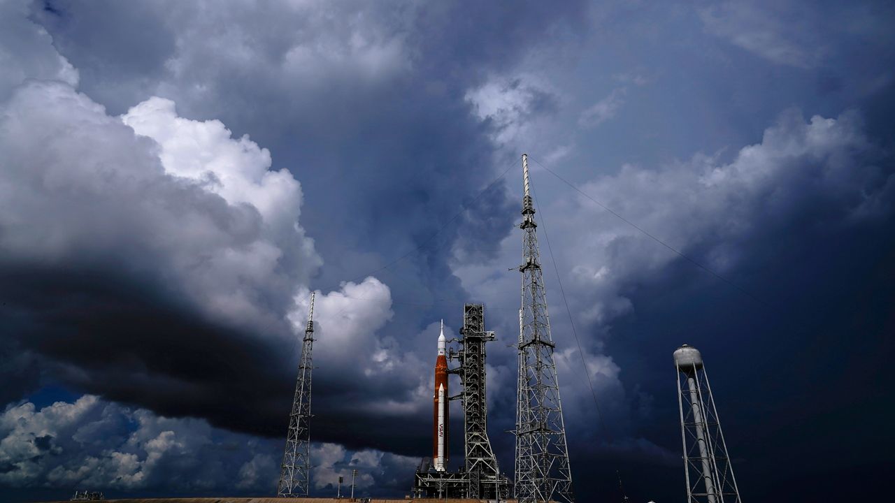 A storm in the Caribbean is threatening to delay NASA's third attempt to launch the rocket. (AP/Brynn Anderson)