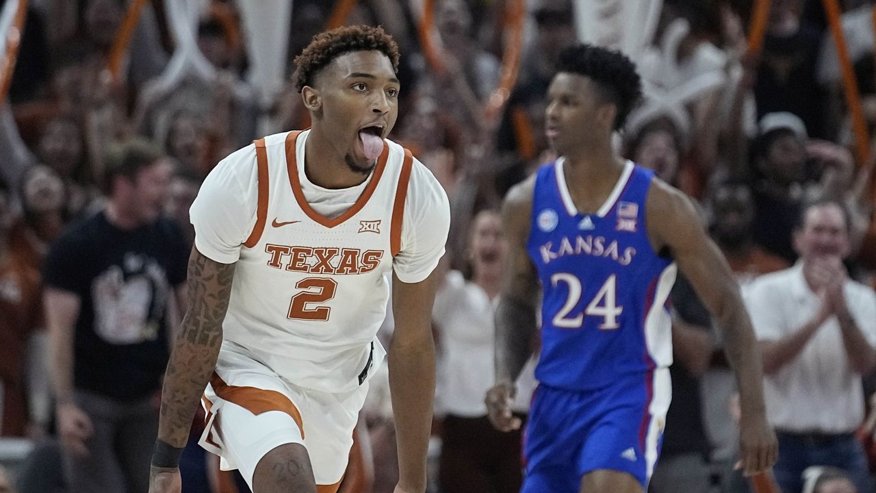 Texas guard Arterio Morris (2) celebrates a score against Kansas during the first half of an NCAA college basketball game in Austin, Texas, Saturday, March 4, 2023. (AP Photo/Eric Gay)