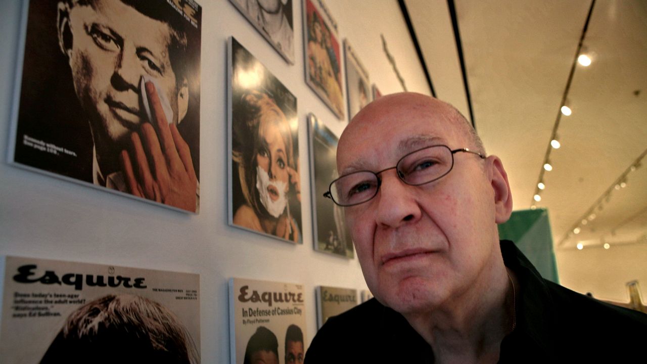 Artist George Lois poses next to his artwork at the New York Museum of Modern Art in New York on April 22, 2008.