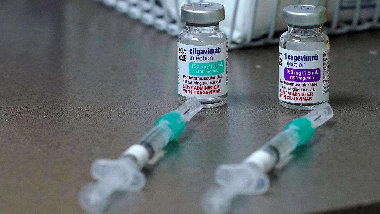 Bottles and syringes holding a two-shot dose of AstraZeneca's Evusheld, the first set of antibodies grown in a lab to prevent COVID-19, rest on a table, Thursday, Jan. 20, 2022 at a University of Washington Medicine clinic in Seattle. (AP Photo/Ted S. Warren)