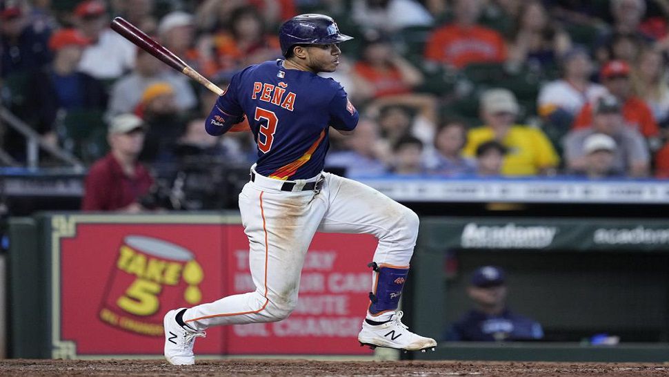 Houston Astros' Jeremy Pena drives in Chas McCormick with an RBI single during the seventh inning against the Tampa Bay Rays, Sunday, Oct. 2, 2022, in Houston. (AP Photo/Kevin M. Cox)