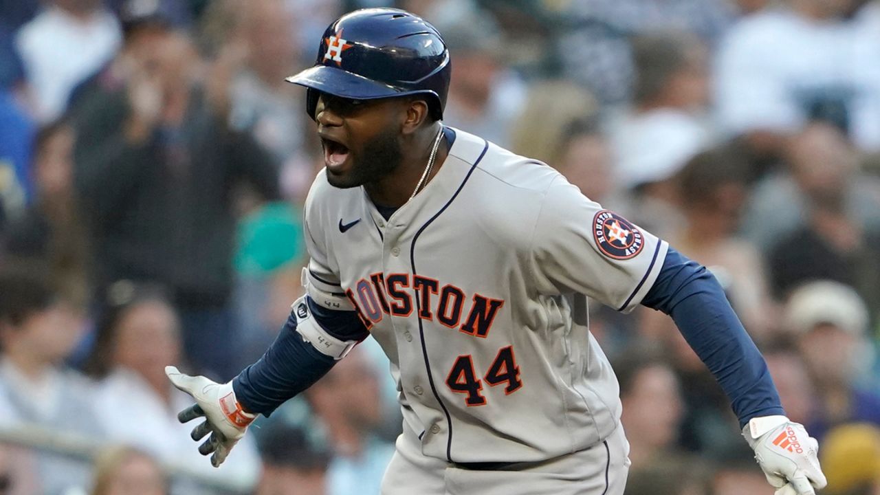 Houston Astros' Yordan Alvarez reacts as he rounds the bases after he hit a solo home run during the fourth inning of a baseball game against the Seattle Mariners, Friday, July 22, 2022, in Seattle. (AP Photo/Ted S. Warren)