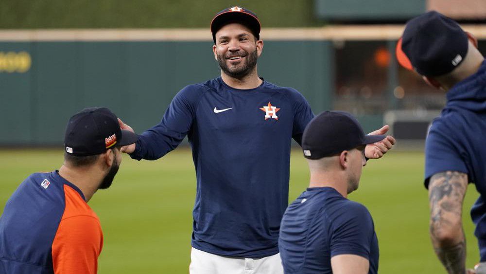 Houston Astros' Jose Altuve smiles as he talks with teammate as the start of a baseball practice in Houston, Thursday, Oct. 14, 2021. The Astros host the Boston Red Sox in Game 1 of the American League Championship Series on Friday. (AP Photo/Tony Gutierrez)