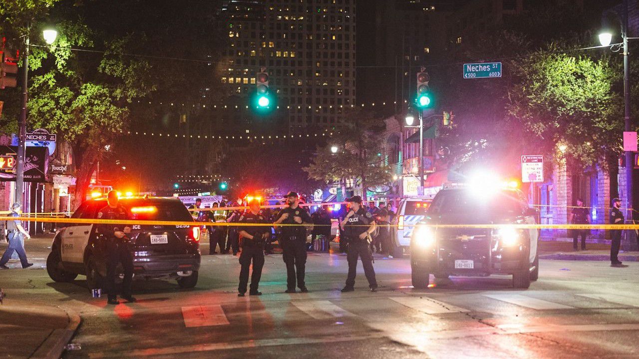 Police and a barricade are visible on 6th Street in downtown Austin, Texas, following a shooting that injured 13 in this image from June 12, 2021. (Courtesy: Metro Video Services, LLC.)