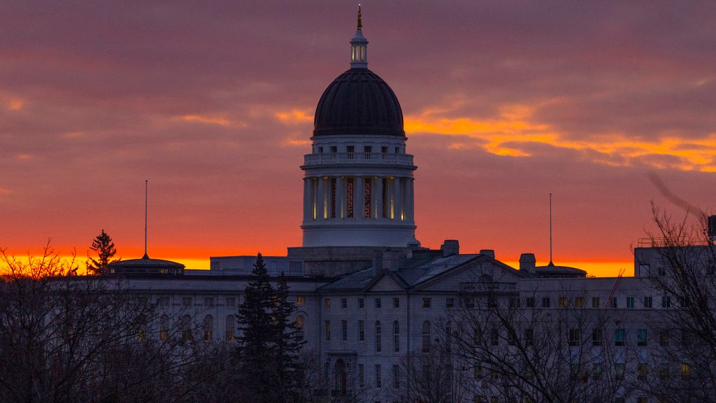 The Maine State House is seen at dawn, Jan. 3, in Augusta. A youth organization and a pair of environmental groups are suing the state of Maine to try to force the state to reduce carbon emissions in the era of climate change. (AP Photo/Robert F. Bukaty, File)