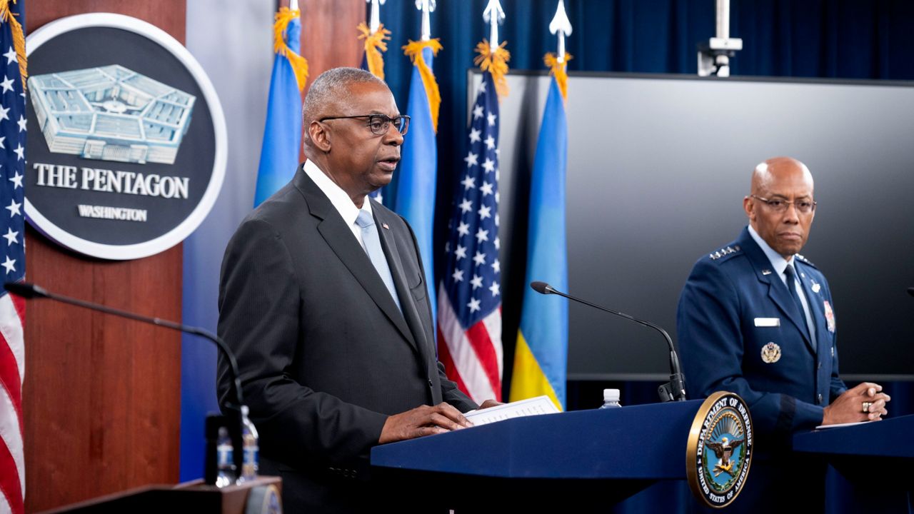 Defense Secretary Lloyd Austin, left, and Joint Chiefs Chairman Gen. CQ Brown Jr. take part in a press briefing at the Pentagon on Monday, May 20, 2024, in Washington. (AP Photo/Kevin Wolf)   Photo Details