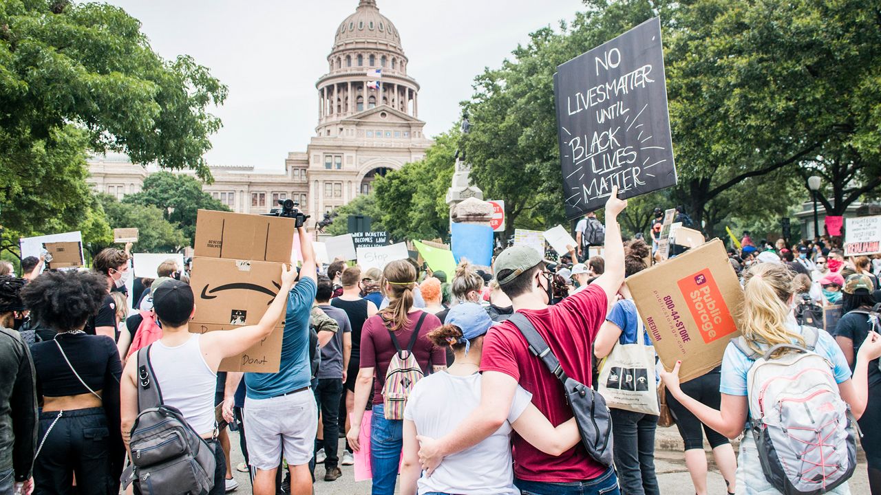 Protesters gathered outside of the Texas Capitol building. (Develon Douglas/Spectrum News)