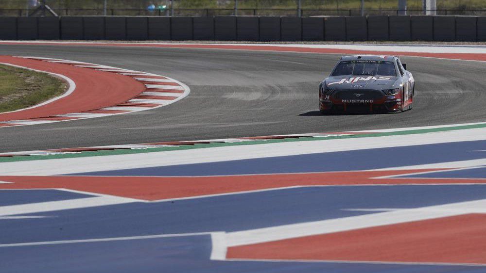 FILE - In this Oct. 31, 2019, file photo, Haas Formula 1 drivers Romain Grosjean, of France, and Kevin Magnussen, of Denmark, drive a NASCAR Cup Series car owned by Stewart-Haas Racing at the Formula One U.S. Grand Prix auto race at the Circuit of the Americas in Austin, Texas. (AP Photo/Darron Cummings, File)